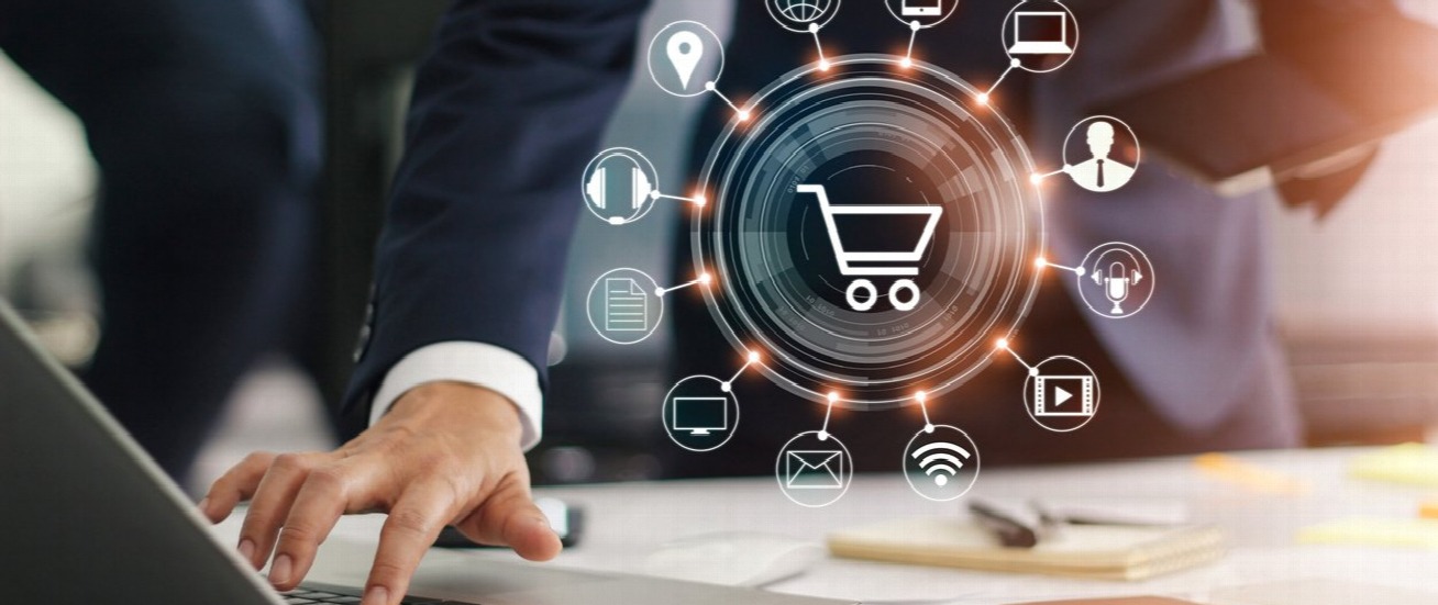 A man working on a laptop in a coffeeshop.